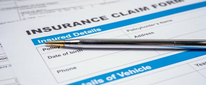 What Happens After You File an Insurance Claim? Insurance Claim Form with a Silver Pen